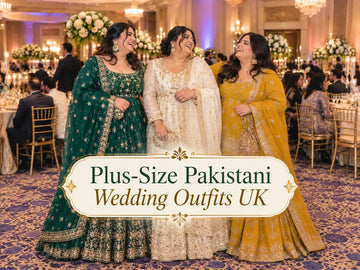 Three plus-size Pakistani women at a UK wedding wearing an emerald A-line lehenga, an ivory pishwas with gold embroidery and a mustard sharara, laughing together in a banquet hall.
