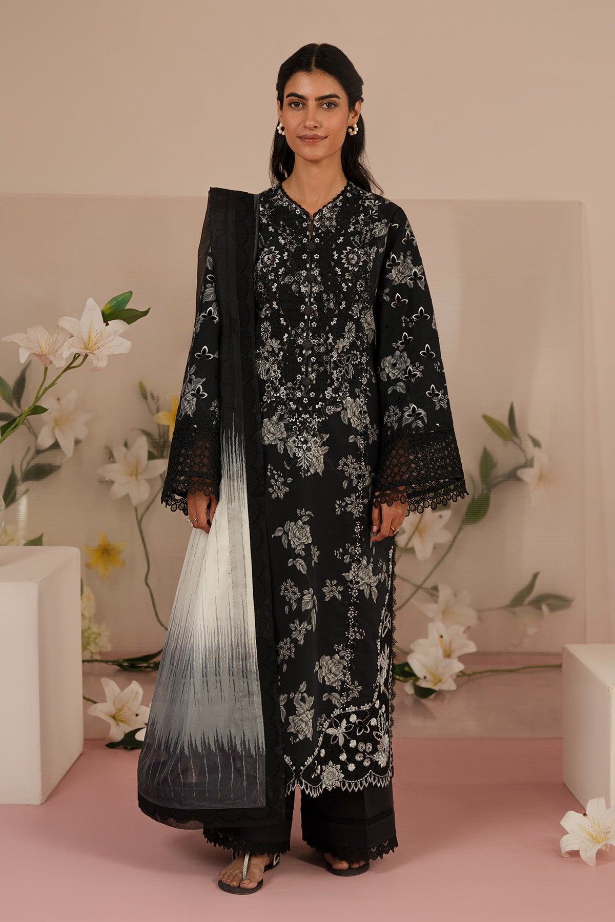 afrozeh black dress Parizaad In a deep midnight black fabric, this threepiece set radiates elegance through its contrast of light and dark. The shirt, tailored in flowing traditional style, is adorned with intricate white embroidery